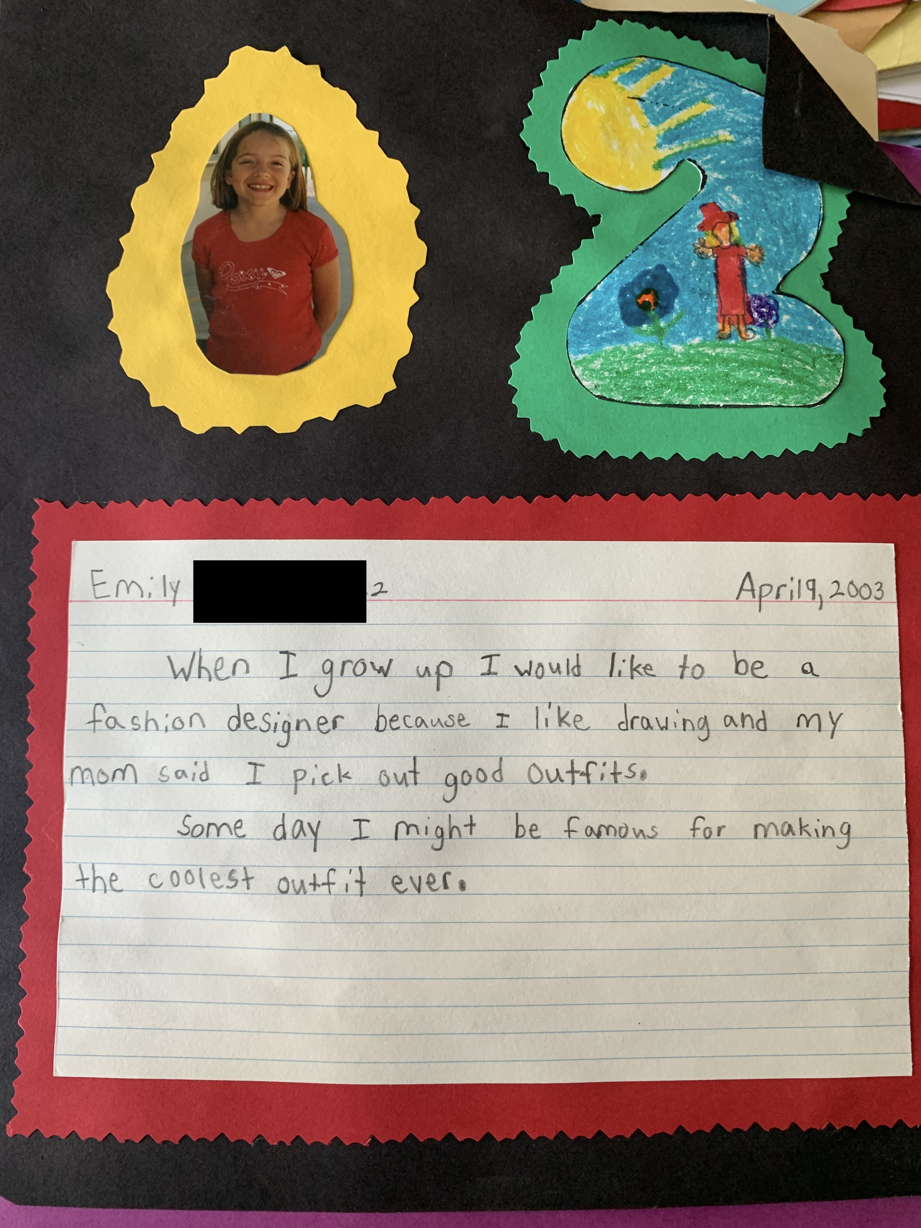 Emily's 2nd grade school project saying she wanted to be a fashion designer because she likes drawing and her mom said she picks out good outfits, and that some day she might be famous for making the coolest outfit ever