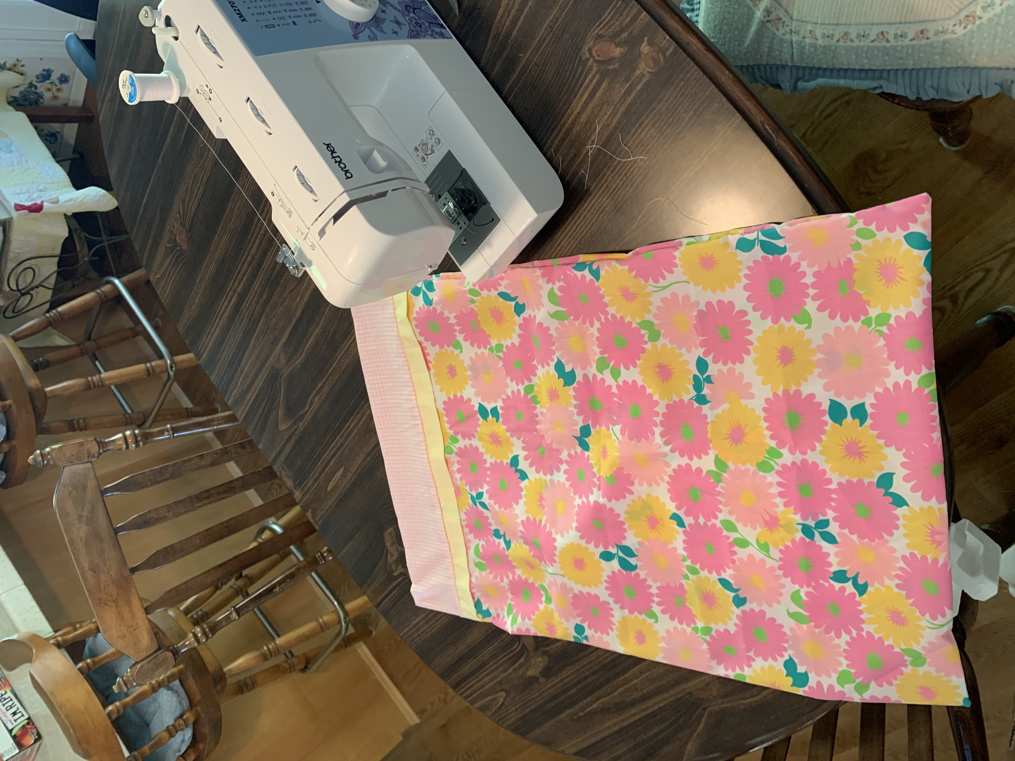 Emily using her new sewing machine at Gamma's house, making a pillowcase