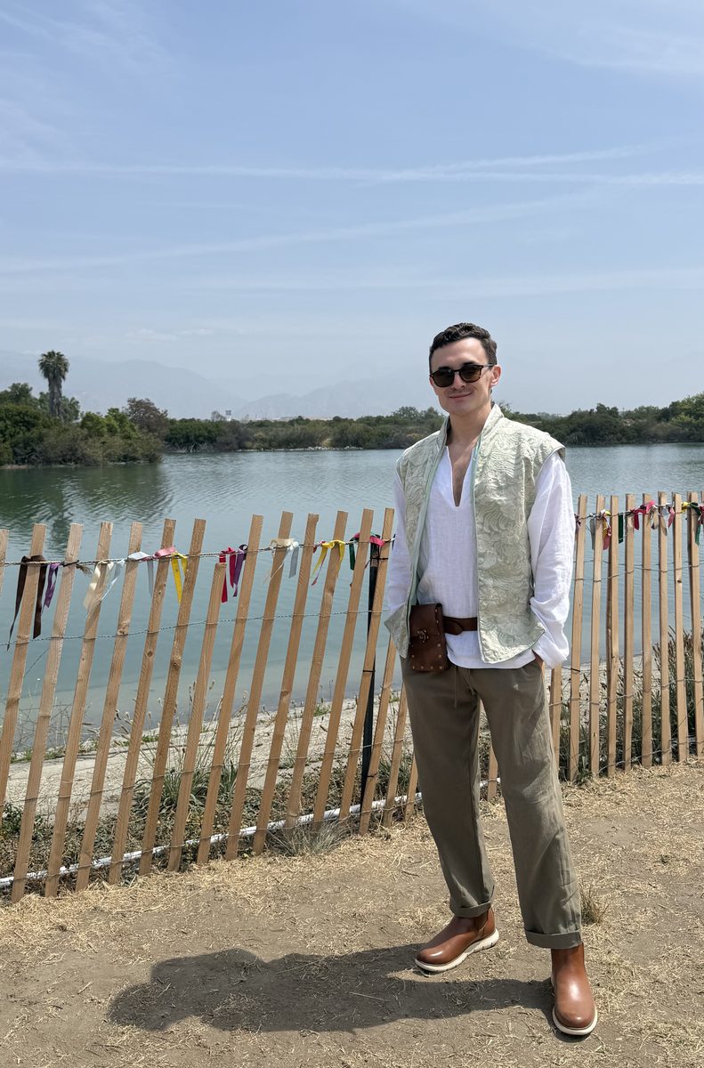 Emily's boyfriend at the renaissance faire in his handmade vest and linen shirt