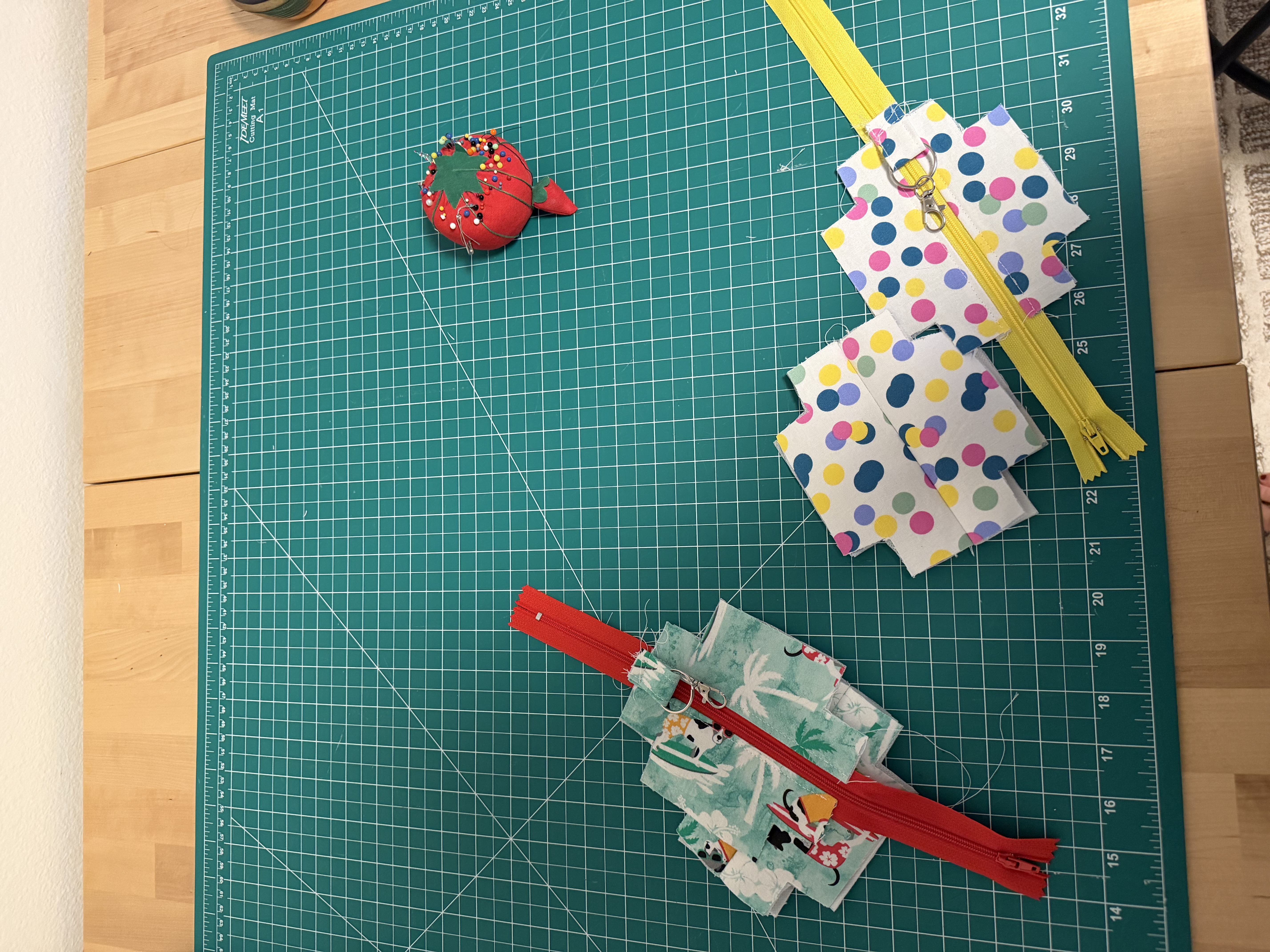 Pinning the swivel clip onto the yellow zipper of the polka dot pouch