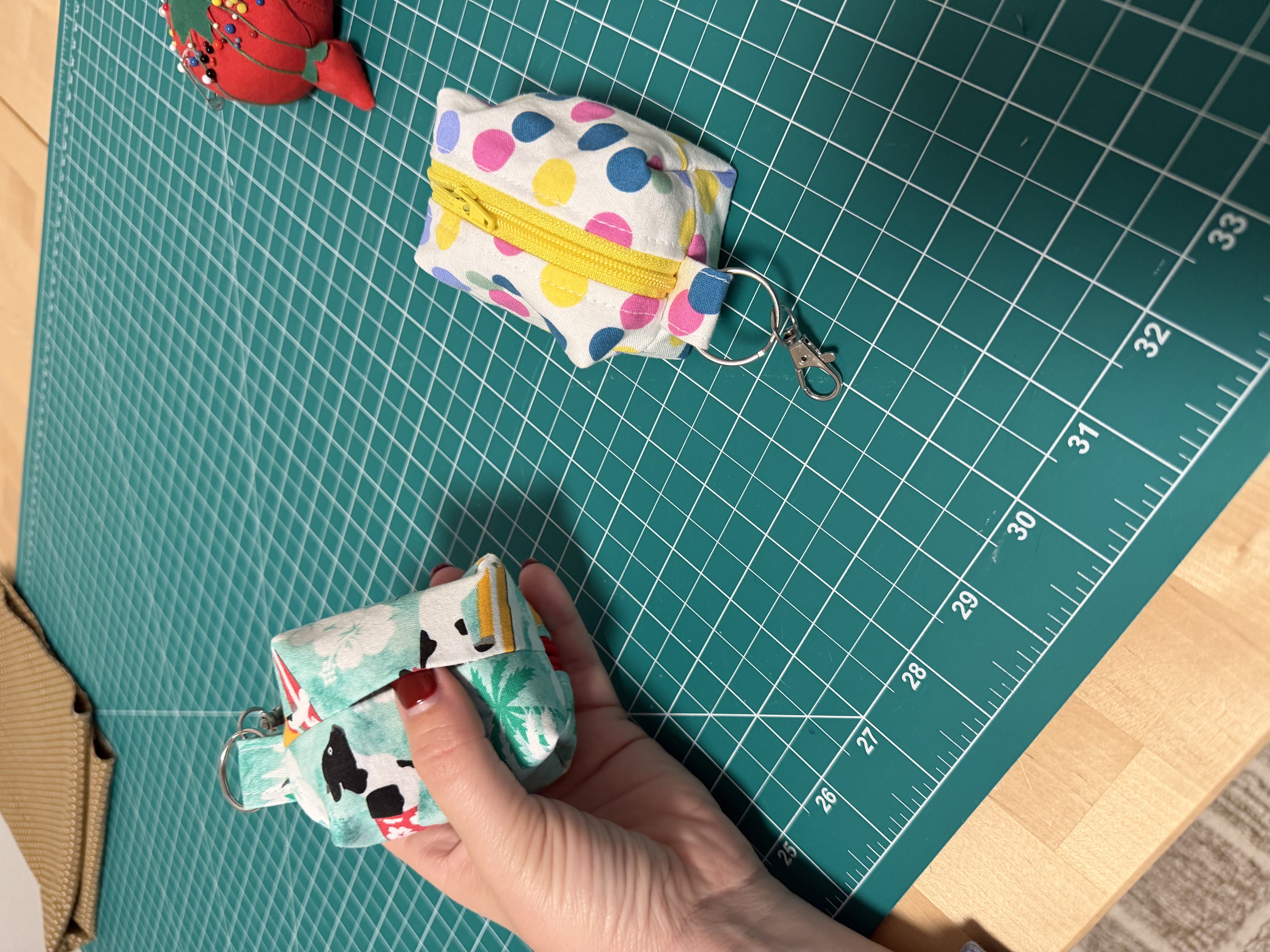 A finished dog poop bag holder showing the open sleeve in the back where you pull a bag out