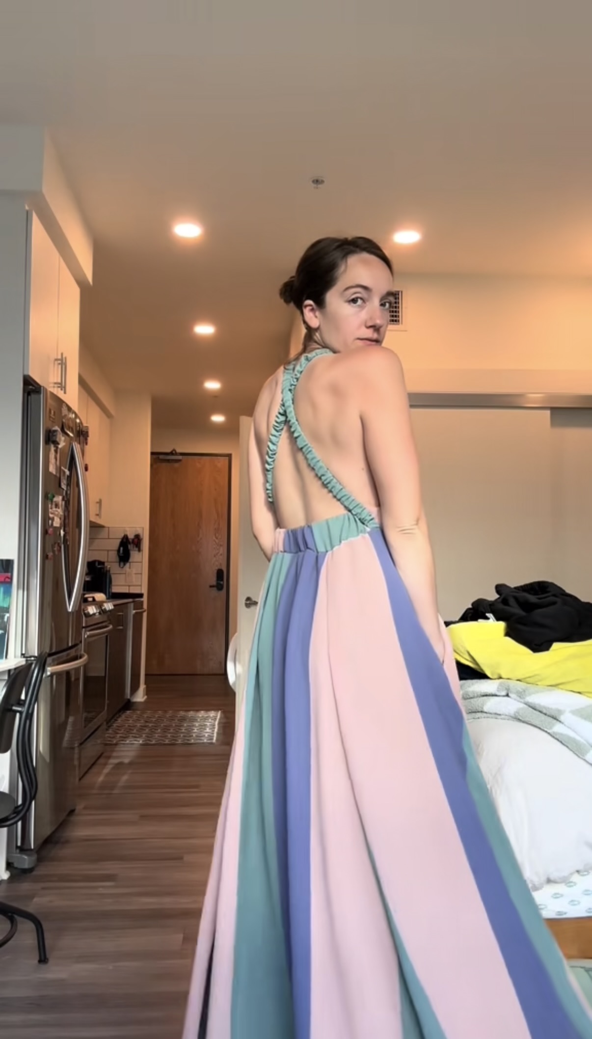 Emily trying on the finished Edith dress at home