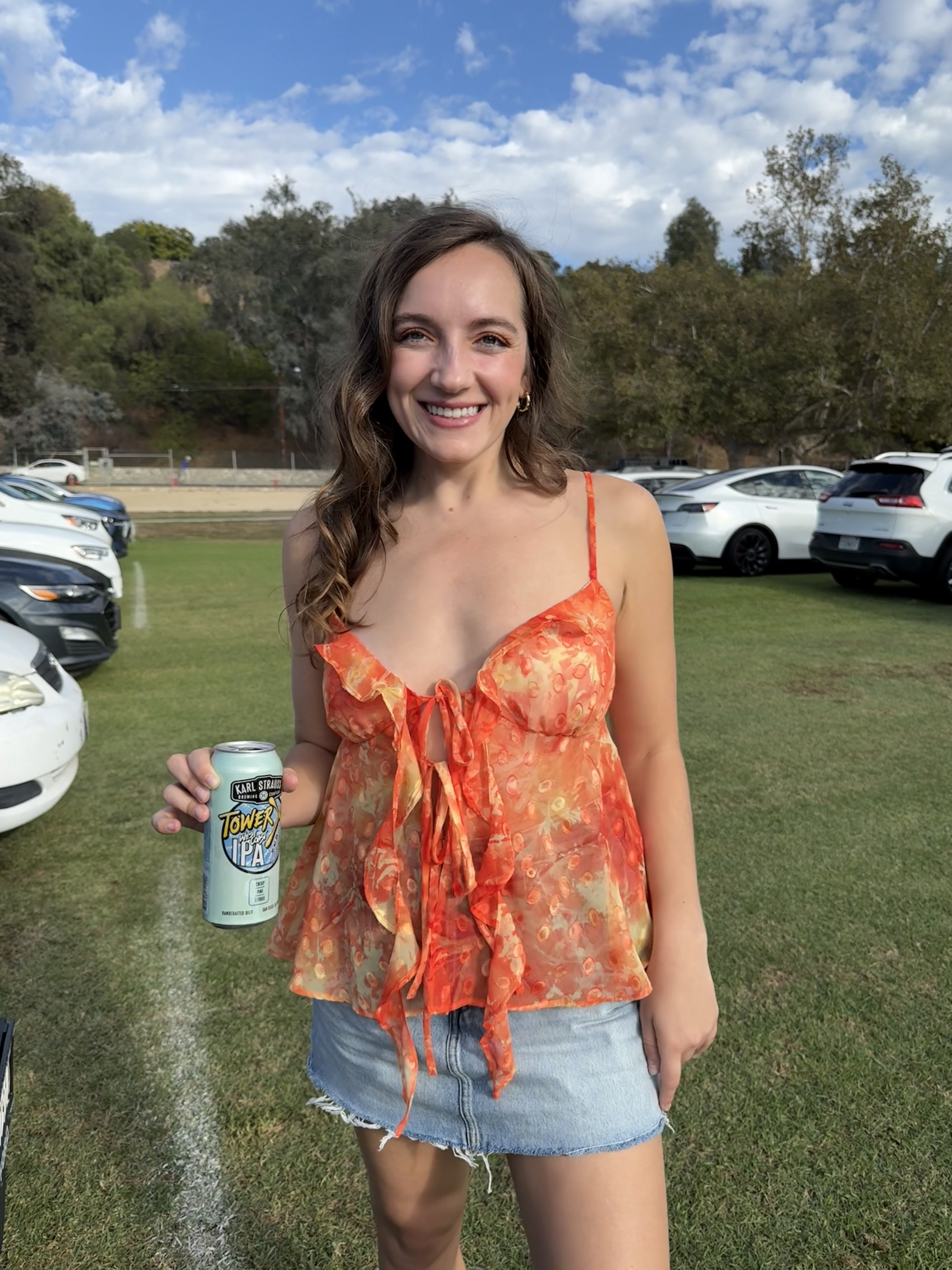 Emily at the Chapel Rhone concert venue wearing the Jaya Top with a denim mini skirt