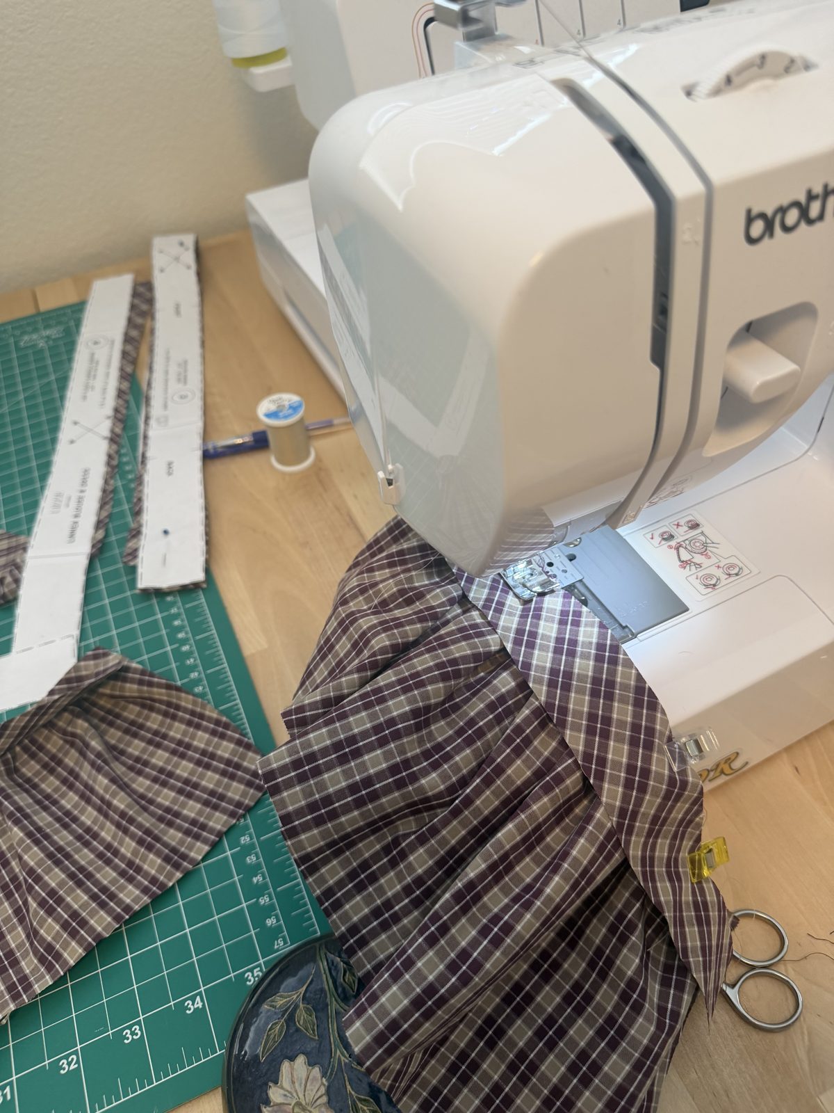 The plaid Linnea dress in progress at Emily's Brother sewing machine