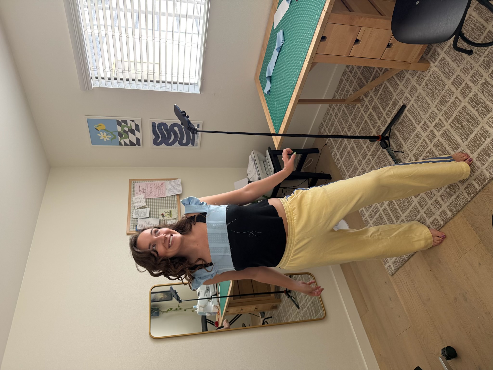 Emily trying on the top piece of the dress before attaching the skirt