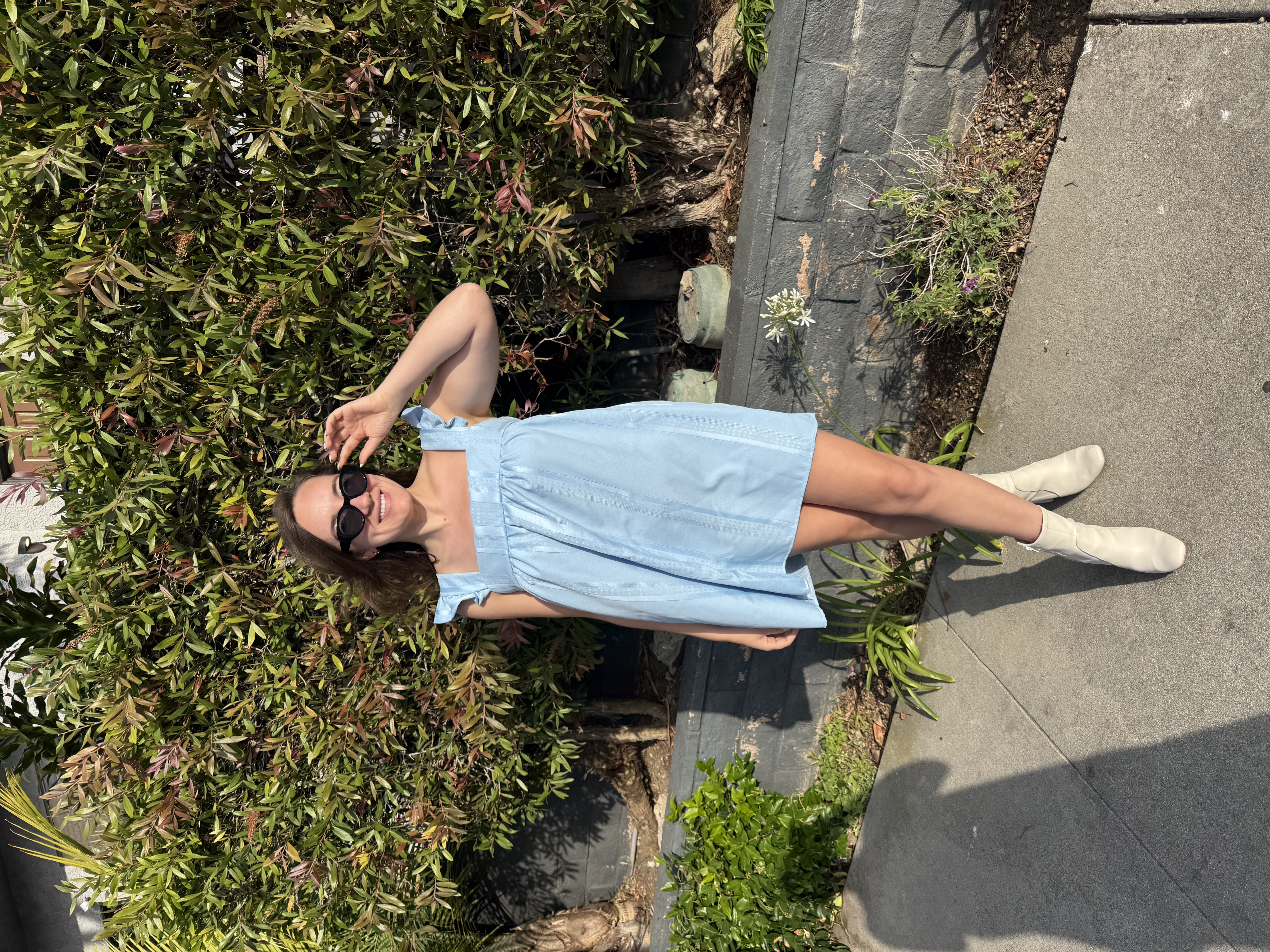 The finished 70s-style mini dress made from a vintage blue tablecloth