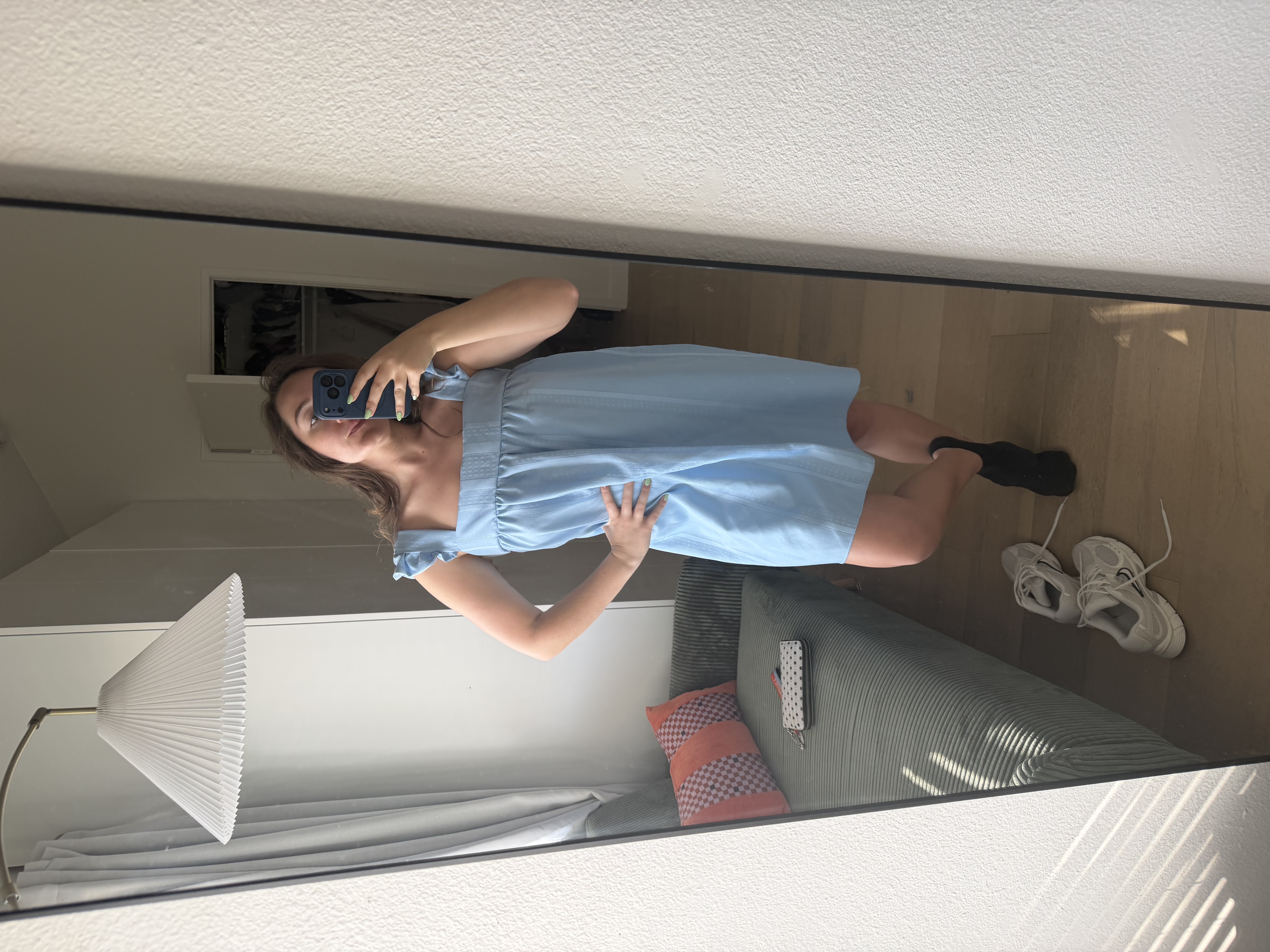 Emily wearing the dress at its original longer length, which looked like a nightgown