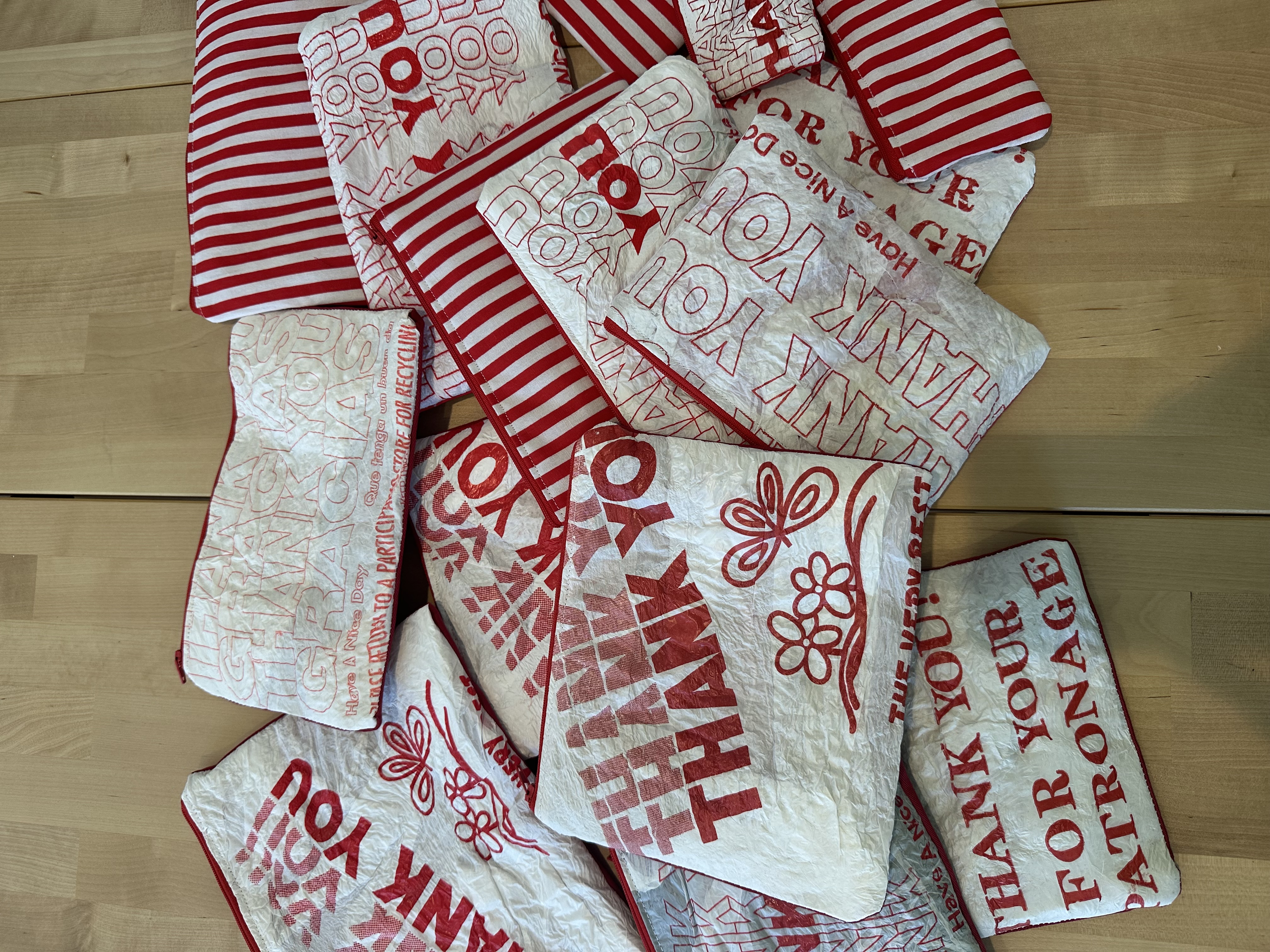 A pile of finished upcycled zipper pouches