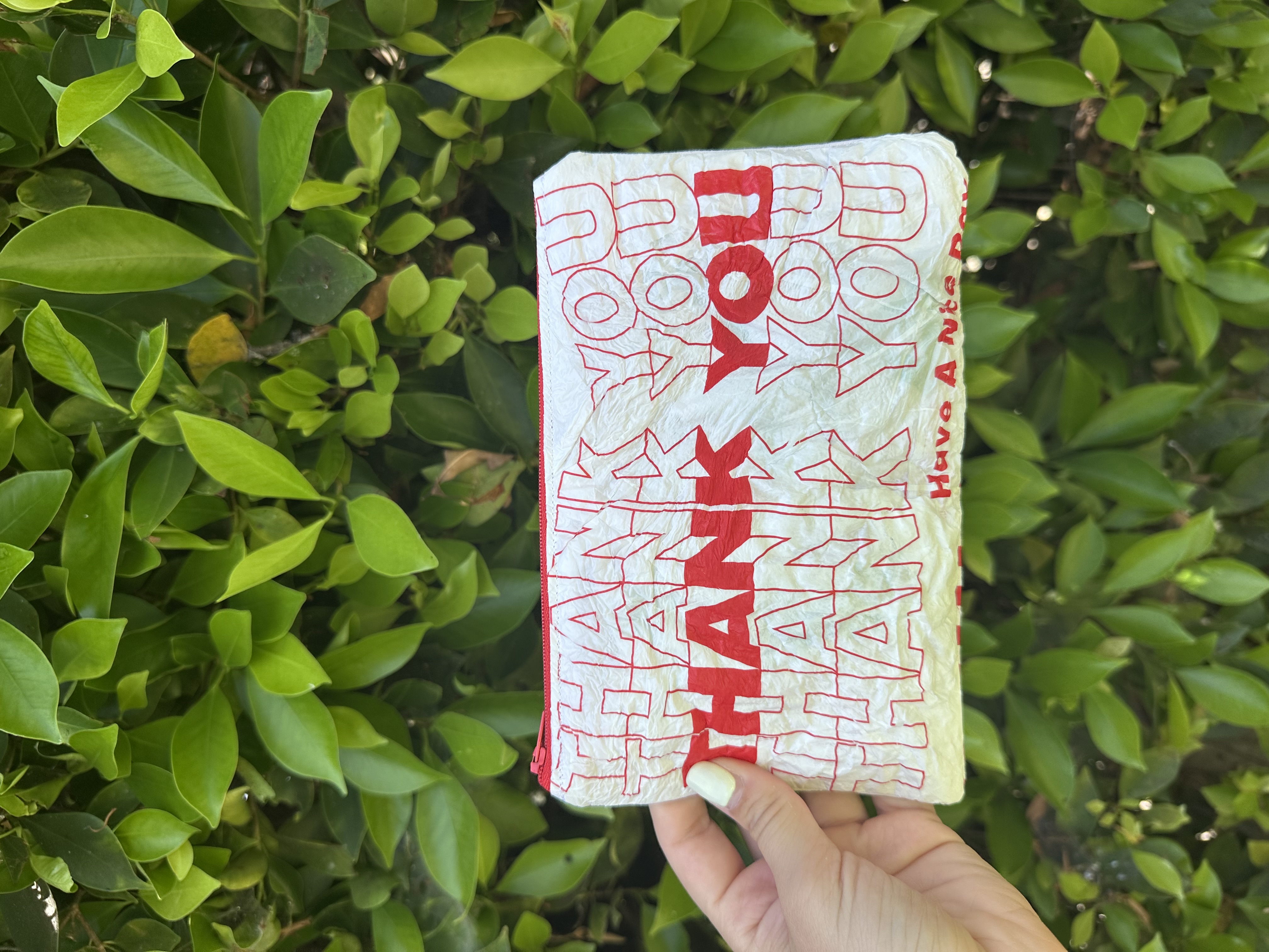 A finished upcycled zipper pouch
